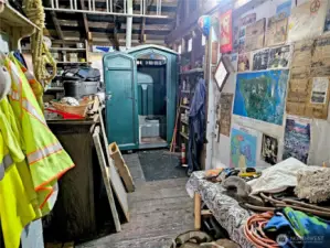 A little unconventional, but the indoor porta potty is vented to the outside and is pumped regularly. Reach out to the listing agent for contact info for the septic company that pumps it!