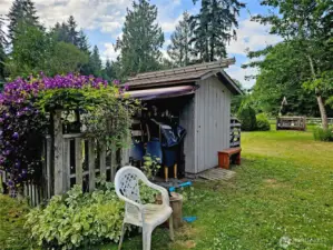 Lovely landscaping and a very serviceable storage shed!