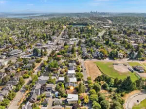 Aerial photo looking south. From this photo you can see downtown Seattle. Coveted Maple Leaf neighborhood. Only minutes to UW, Children's, downtown, Amazon and 520. Walking distance to light rail, cafes, restaurants and grocery stores.