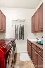 Large laundry room with lots of cabinetry