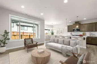 Virtually staged living, kitchen and dining room.