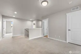 The upstairs loft works well as an office, den, or playroom.