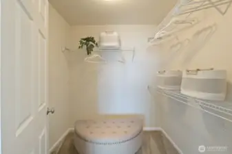 Primary bedroom walk-in closet