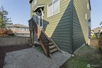Fully fenced backyard, showing the deck & stairs off the kitchen