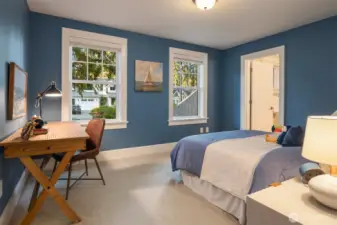 A bedroom suite with full bath and walk-in closet.
