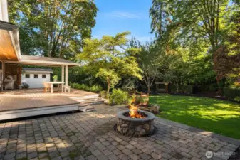 An expansive deck with patio and firepit.