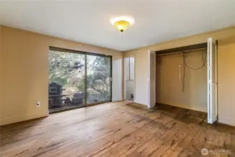 Primary bedroom with double sliding glass door