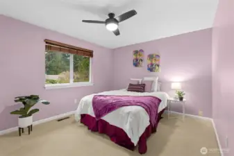 Next to the den/bedroom, the third bedroom is extra spacious with a double-wide closet and ceiling fan.  Great for guests or residents, next to the full bath.