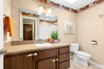 The full bath has a spacious vanity and tub/shower combination with updated plumbing and light fixtures.