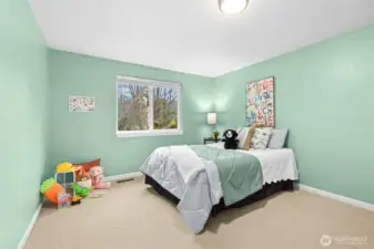 Next to the primary bedroom discover an extra long bedroom with a very deep step-in closet, not seen in photo.  The extra length makes a great space for any generation, with extra floor room.  Great yoga, or craft space too.