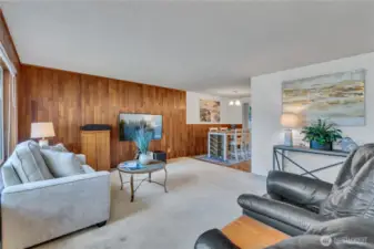 Living Room is open to dining area and adjoins cozy updated kitchen