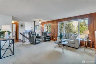Large living room looking towards entry and hallway accessing 2 bedrooms