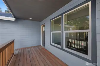 Spacious covered front deck & entrance.