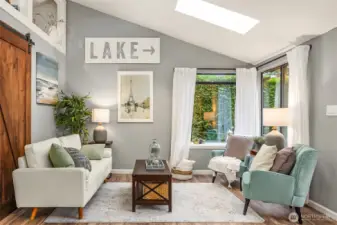 Vaulted ceilings and abundant windows make this cozy space live large.