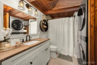 Updated bath with room for full size stackable washer/dryer