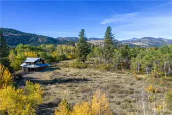 House tucked in the aspen and pines