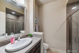 Main floor 3/4 bathroom is next to one of the main floor guest/office room.