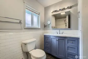 Updated bathroom with a jetted bathtub.