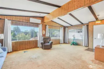 Living room with vaulted ceilings.