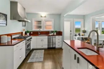 Kitchen is the heart of the home; with access from the office or hallway and open to the breakfast nook and living room. Door from breakfast nook for easy exterior access.