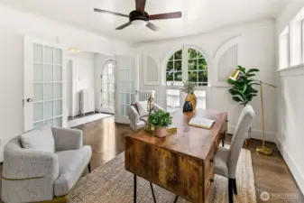 Bonus room at the entry is excellent office or TV space. Arched windows are doors which fully open.