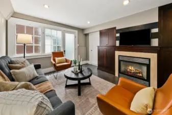Middle level living room with gas fireplace.