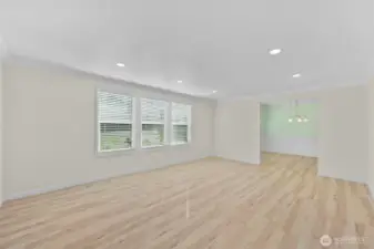 Large living room with dining room in back of photo.