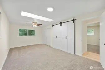 Primary bedroom with skylight