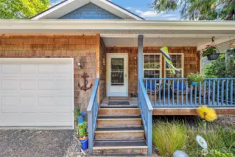 Beachy cedar shake siding and inviting covered front porch