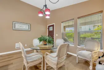 Very roomy dining room overlooking the serene backyard