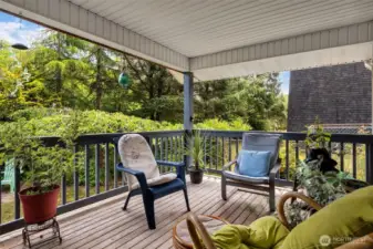 Covered back deck. Perfect for entertaining guests or enjoying a quiet evening