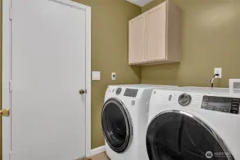 Utility room including front loading washer and dryer