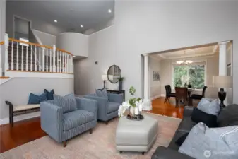 The front living room feels extremely open with the massively tall ceilings.