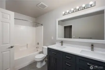 Full guest bathroom serving the 3 bedrooms and media room upstairs.
