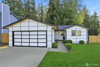 Beautifully-updated rambler on spacious corner lot.