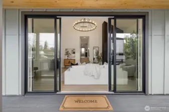 Oversized sliding doors lead onto the Trex Deck