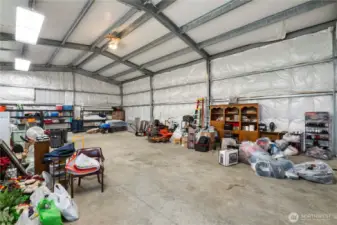 The shop is insulated, has power and an extra tall 12 foot door to park an RV or add a car lift. The 6 inch slab can take it!