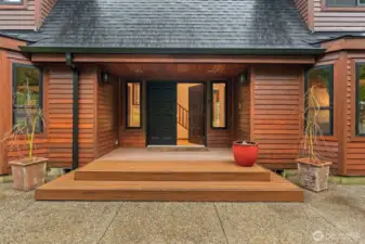 Rich wood tones and clean architectural lines create an immediate sense of home and high-end craftsmanship while entering this gorgeous home.