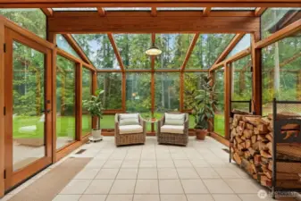 Relax, recharge, and reimagine your daily living with this gorgeous wood-beamed sunroom bathing in light.