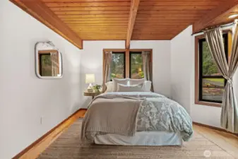 Thoughtful design at every turn. This extra bedroom balances everyday utility with the elevated aesthetic of a custom cedar-built home.