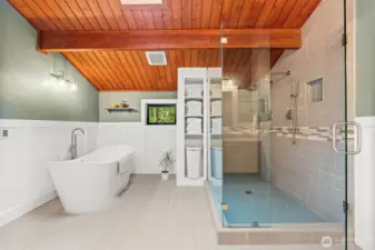 Clean, spacious, and serene. This primary bathrooms glistens while accentuating it's updated tilework.