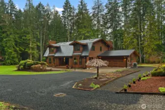 Newly graveled driveway can accommodate multiple vehicles with ease.