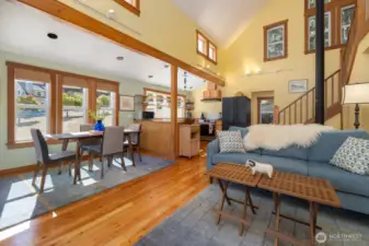 Open floorplan with bright living, dining, and kitchen area