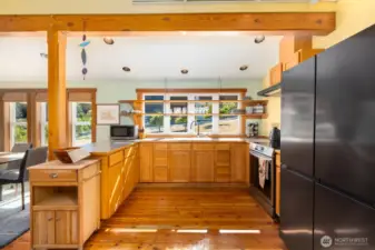 Kitchen with gorgeous open shelving and induction range.