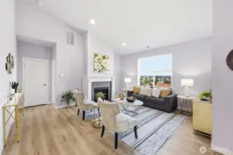 Architectural style, vaulting ceilings and a commanding fireplace make this living room quite versatile while giving off great light and energy vibes.