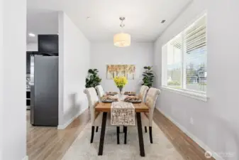 The more formal dining room off the kitchen, or use it as your home base office/den, conveniently connected to snack cabinets.