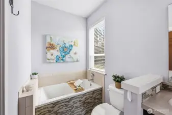 Primary suite deep soaking tub.