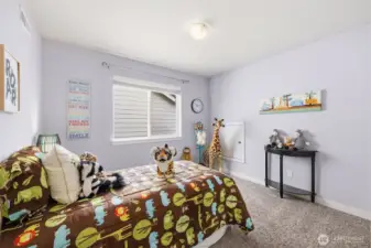 The north bedroom of the upper floor. It features a full-size closet out of frame.