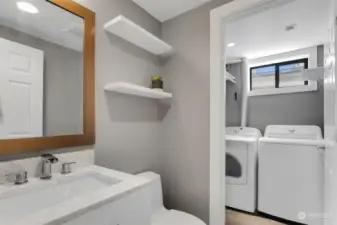 Laundry room and half bath.  Appliances stay.