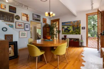 Dining area has two oversize door out to deck.